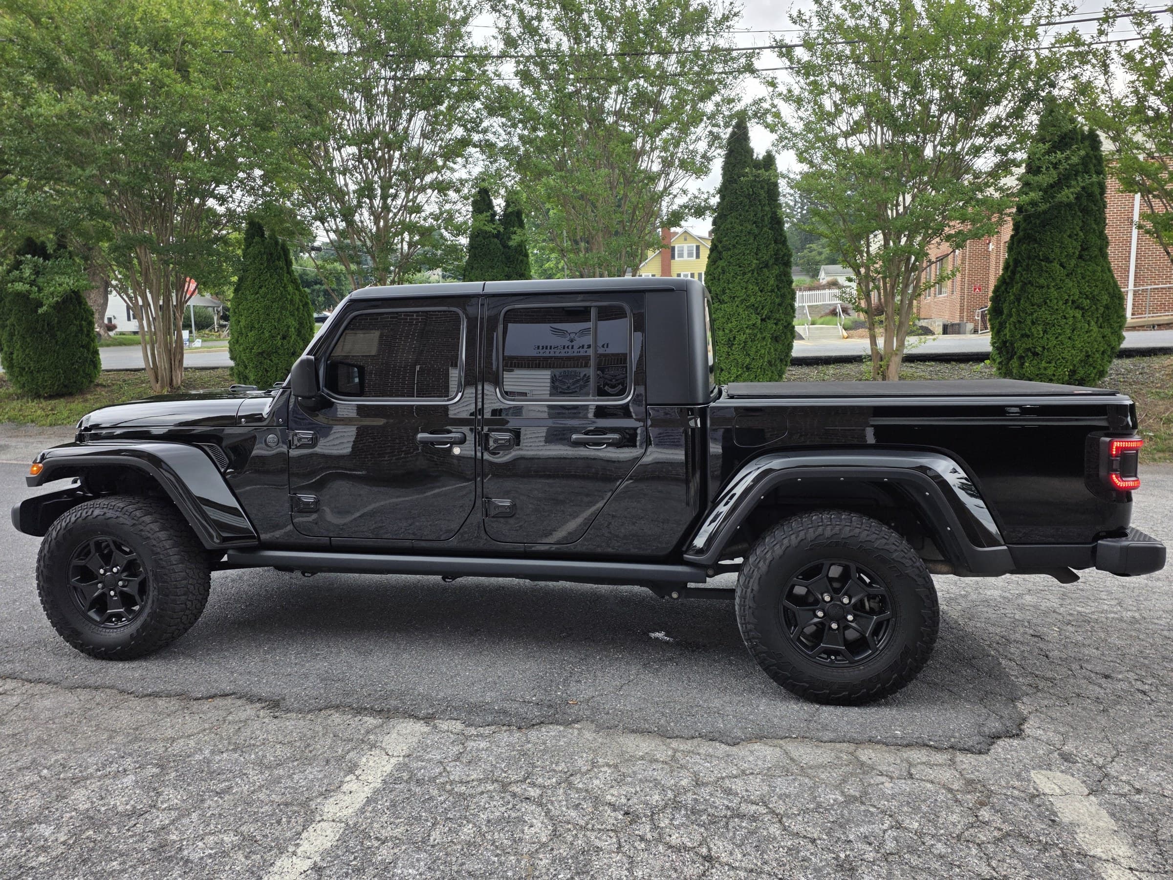 A fully detailed blacked out Jeep Gladiator gleaming in Carroll County, MD